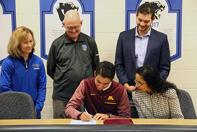 Declan signing letter for University of Minnesota