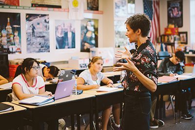 Teacher in front of engaged classroom