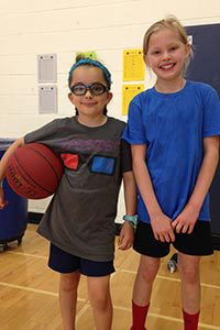 lower school students playing basketball