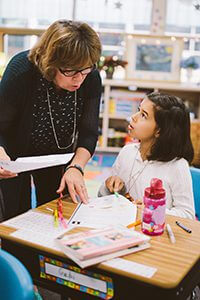 Teacher talking to student