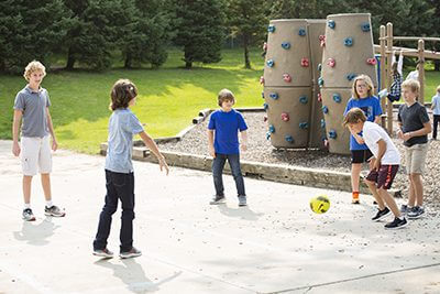 Boys playing soccer at recess