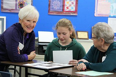 Student working with grandparents