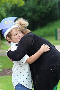 Ms. P hugging student