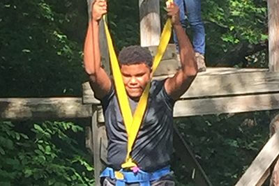 student on ropes course