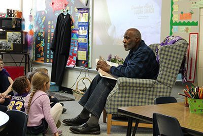 Justice Alan Page reading to kindergarteners 