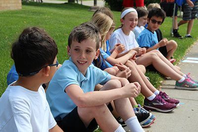 lower school students hangin gout together at lower school entrance