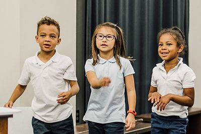 lower schoolers dancing in theatre
