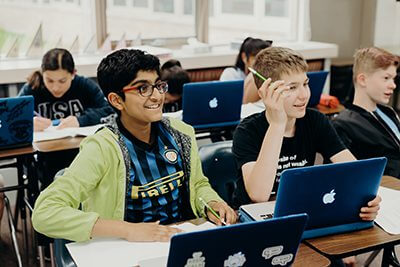 middle school boys participating in class discussion