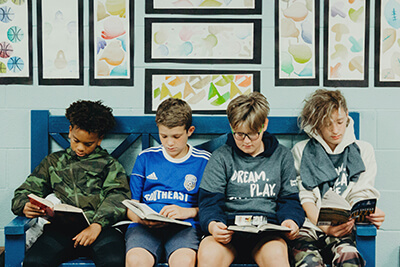 middle school boys reading together