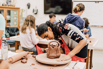 middle School student working in ceramics class