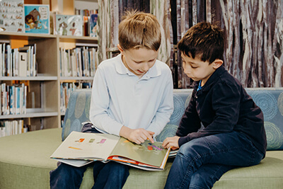 lower school boys reading in the new library