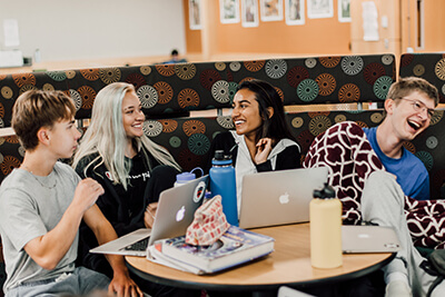 upper school students working together in the commons