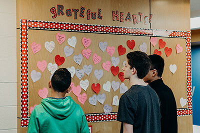 students reading the grateful hearts