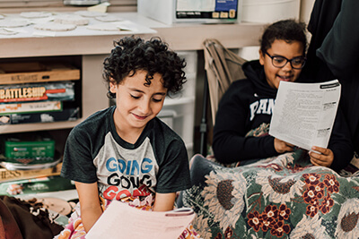 middle school students reading together