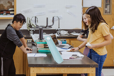 middle school students in the science lab