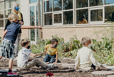 kindergarten exploring in the new garden