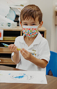 perk student coloring with his mask on