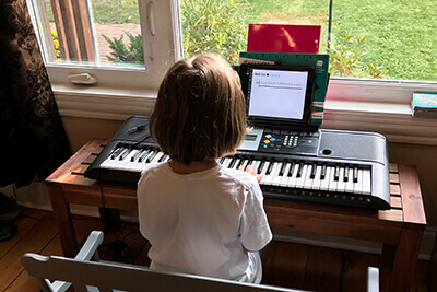 Eloise playing piano