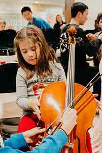 Eloise tries the Cello