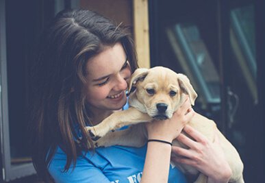 Sammie Garrity with a puppy