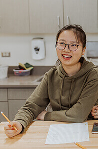 Lareina Gu working on math in the makerspace in 2019