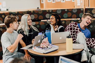 upper school students in the commons