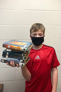 Mitch holding books 