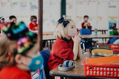 lower school student watching in class