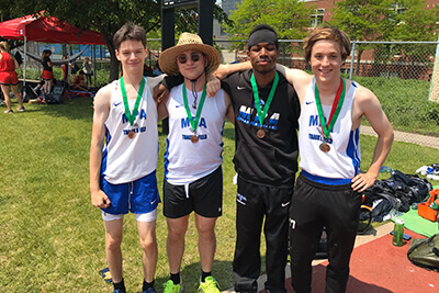 Boys 4x100m Relay Poses For Picture With Their Medals