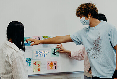 upper school students giving classroom presentation