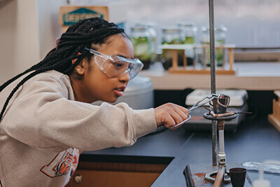 upper school student in a chemistry lab