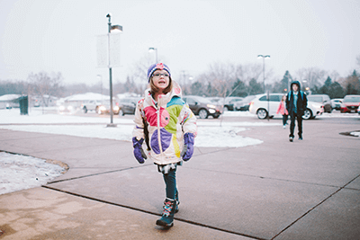 Student entering school in the morning