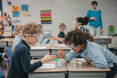 Fourth graders doing an experiment together