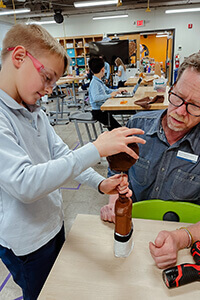 fourth grader working in the makerspace