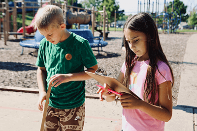 Middle School students doing an outdoor science lab together