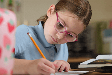 Lower School student working at their desk