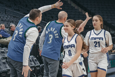 Hadley playing basketball at the Target Center