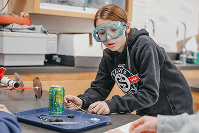 Middle School students works with fire. 