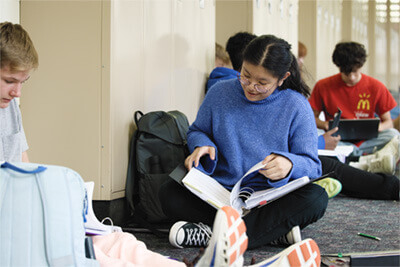 Hannabella working with students in her class