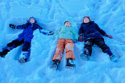 Students playing in the snow at recess