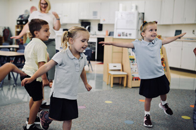 PreK students dancing together