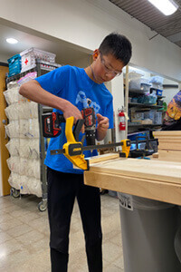 Robin working on a project in the Makerspace