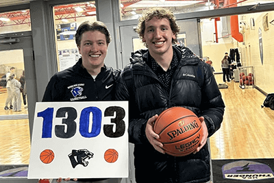 Wyatt Srsen '25 and Brendan Connolly '17 pose after Wyatt's record-breaking night. 