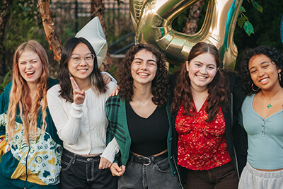 International student with friends in the courtyard