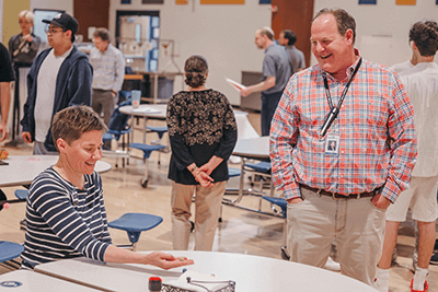 Upper School Director Mark Segal and Teacher Katie Murr enjoying the Asian American/Pacific Islander Celebration.