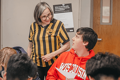 An Upper School student talks with a college counselor. 