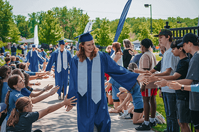 A member of the Class of 2023 embarks on the Senior Walk. 