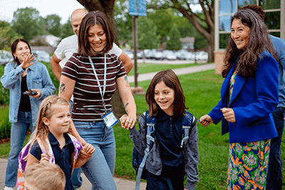 Dr. Lori-Anne Brogdon, head of school, welcomes students on the first day of school.