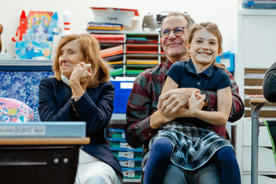 A Lower School student and her grandparents