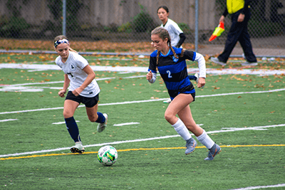 a Middle School student playing in her soccer game.